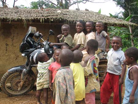 by Alan Whelan, UK; Kids on Tiger near Mamfe, Cameroon, trans-Africa trip - Lancashire to Cape Town; Triumph Tiger 955i.